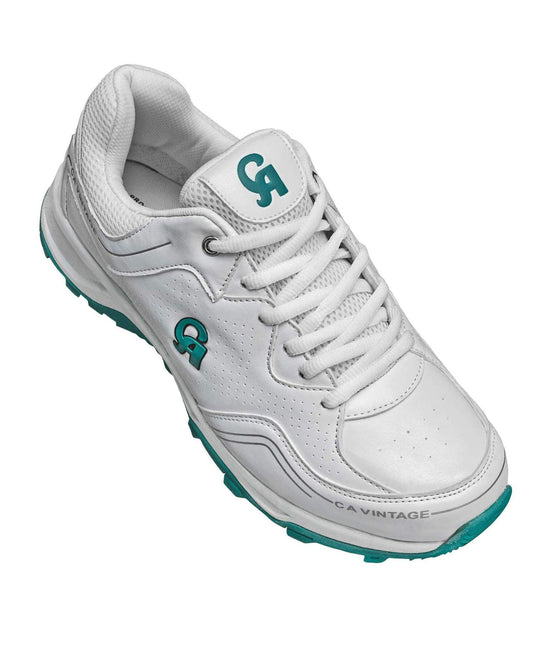 The CA Pro Vintage Grippers are white athletic shoes enhanced with teal accents and feature the "CA" logo on both the tongue and side. Crafted from synthetic leather, these shoes offer a perforated design for optimal breathability, a cushioned interior for added comfort, and a high-traction rubber outsole. The brand name "CA VINTAGE" is prominently displayed near the toe.