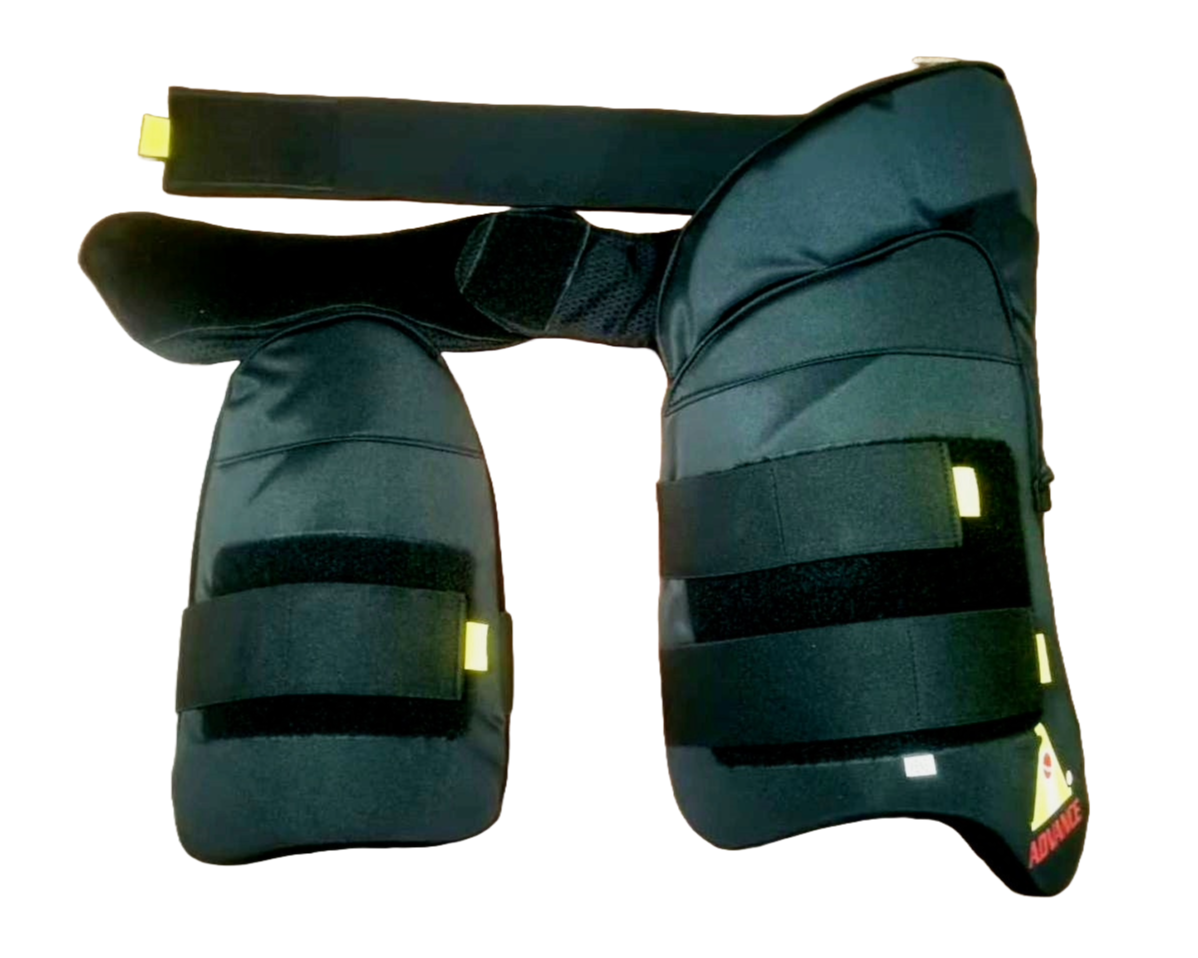 A cricket enthusiast wearing a yellow shirt is shown from the waist to mid-thigh level. They are sporting Advance P1 white, padded cricket leg guards with straps and yellow accents for impact protection from the brand Advance. The background is plain white.