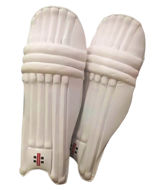 The Gray Nicolls Legend - Master Replica cricket batting pads, featuring vertical ridges and padded straps, are crafted from shock-resistant material. Designed to protect the legs with a logo near the bottom, these white pads are perfect for cricket enthusiasts. The two pads are positioned slightly overlapping each other.