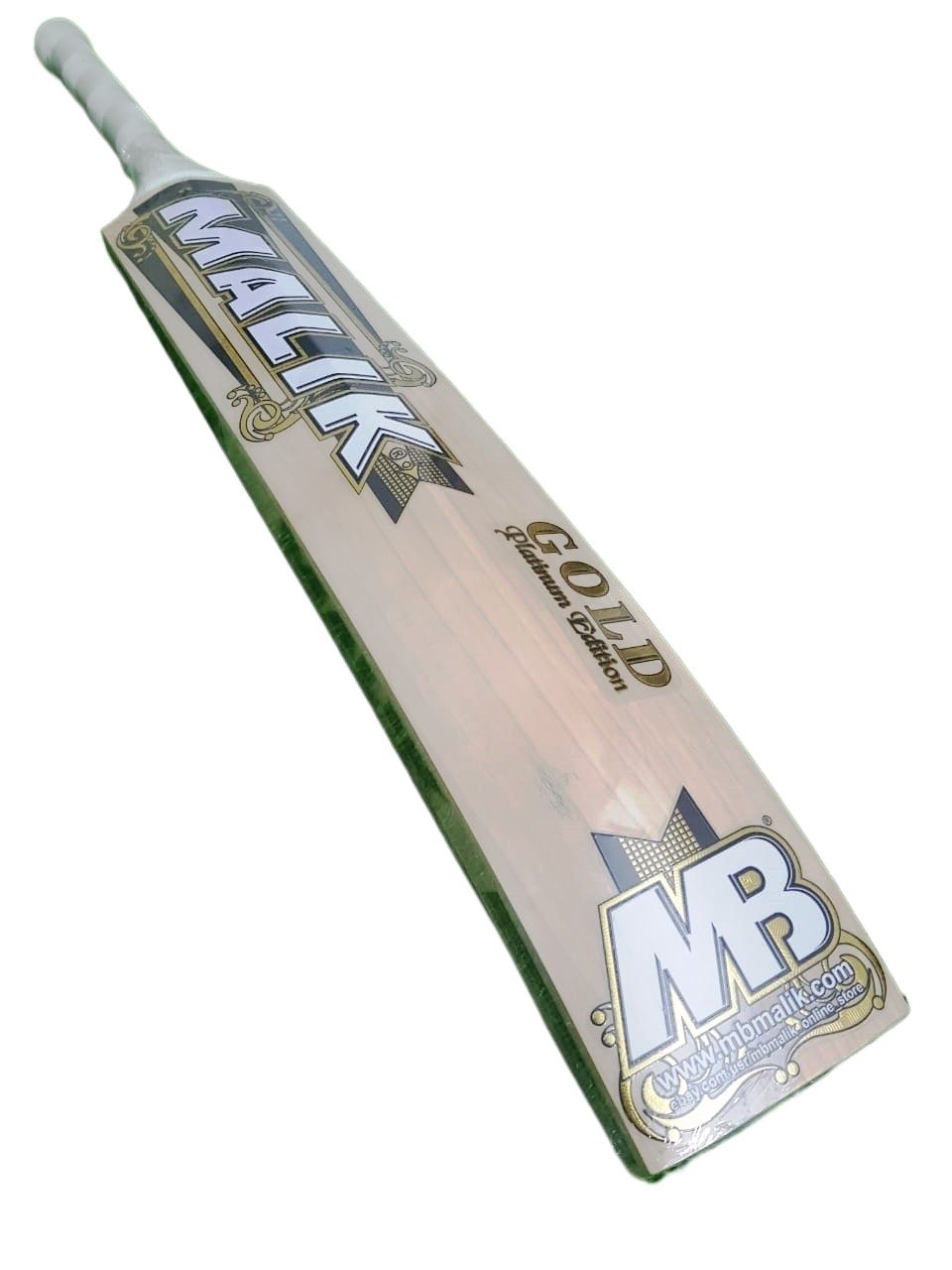 Two MB Malik Gold cricket bats, expertly crafted from professional standard pro grade English Willow, are standing side by side. The left bat displays the front featuring the "MB Malik Gold" name and decorative designs. The right bat reveals the back with "MALIK" written vertically in bold letters. Both bats are equipped with black handles.