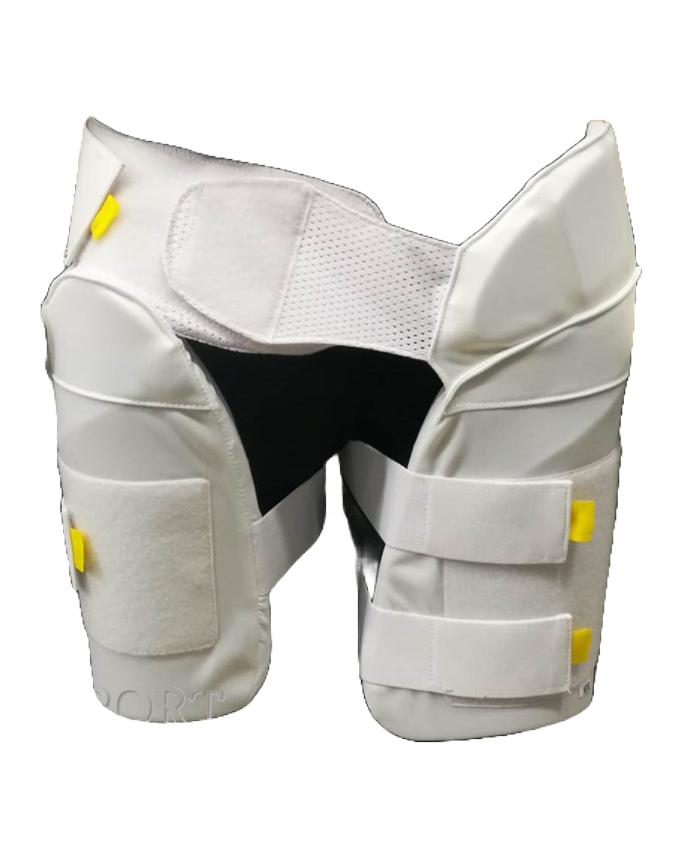 A cricket enthusiast wearing a yellow shirt is shown from the waist to mid-thigh level. They are sporting Advance P1 white, padded cricket leg guards with straps and yellow accents for impact protection from the brand Advance. The background is plain white.