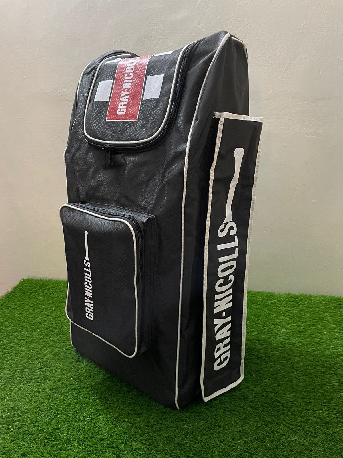 Under-19 Black Edition spacious cricket kit bag with compartments for full gear set