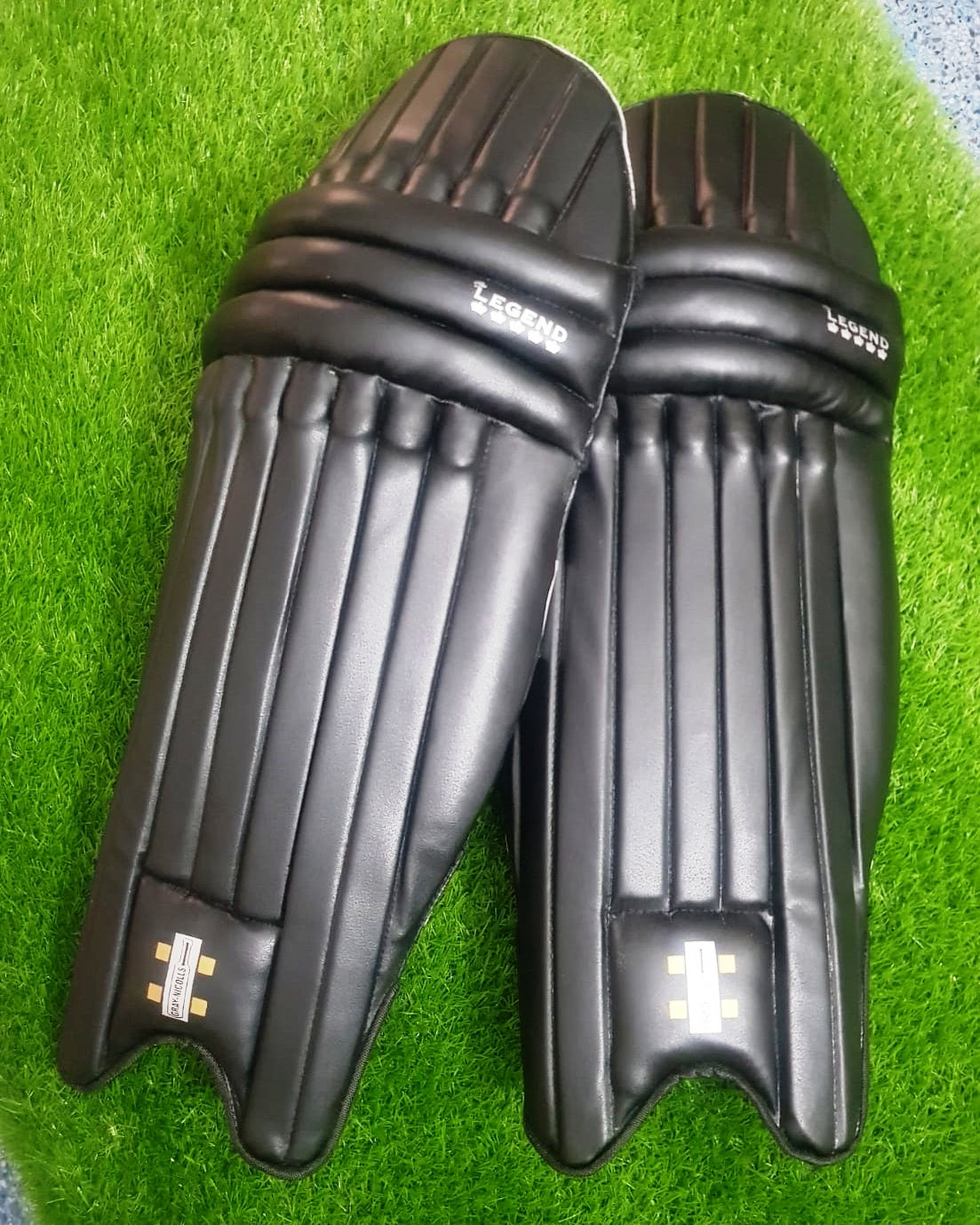 Under-19 Black Edition cricket batting leg pads with lightweight professional protection