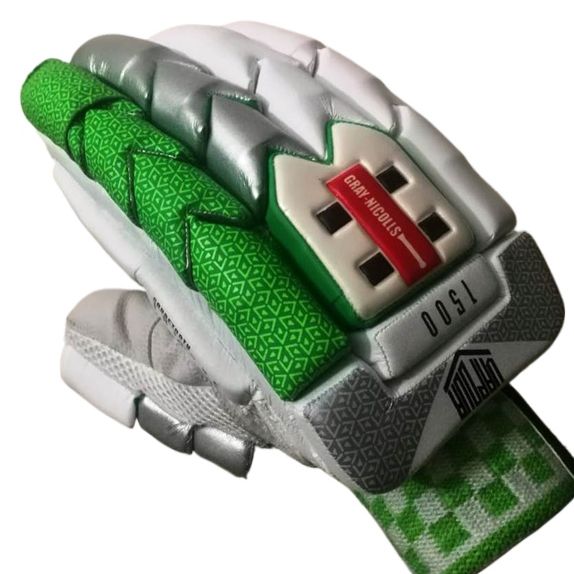 The Gray Nicolls Vapour 1500 Green - Master Replica batting gloves feature a white and silver color scheme with striking green accents. The back of these cricket gloves showcases a textured green pattern, and the label proudly displays "Gray Nicolls," "1500," along with a distinctive red and white cross design for superior impact protection.