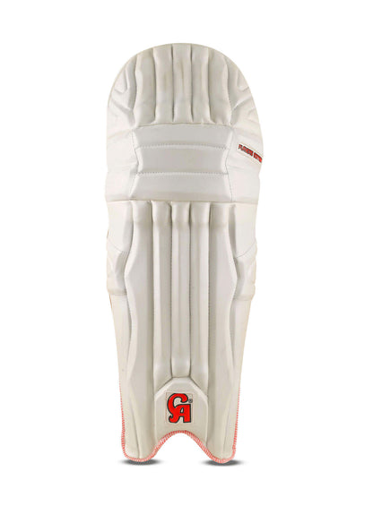 The image showcases the CA 15000 Player Edition batting pads. The front view reveals a white padded surface with minimal red accents, while the rear displays red and black straps for securing the pads. Designed for cricket protection, these pads feature shock absorption technology. The brand logo "CA" and "Plus 15000 Players Edition" are visible.