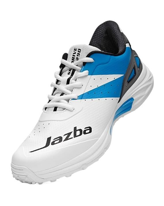 A white and blue athletic shoe, branded "HS," prominently displayed on the side, designed as the Jazba Skydrive 290. These cricket shoes feature synthetic materials with blue accents and black details on the tongue and heel area, offering excellent traction. The sneakers boast a sleek and modern design.