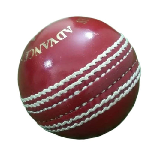 A red leather cricket ball from the "Advance Target 300 - 156g Red - Pack of 6 Balls" collection is featured against a plain white background, showcasing its prominent white hand-stitching. The ball boasts the brand name "ADVANCE" engraved in gold letters on one side, emphasizing its premium quality.