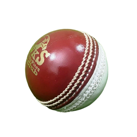 A close-up image of a Super Match 156g Dual Color cricket ball by Advance, featuring red leather with white stitching. The side of the hand-stitched ball displays a logo and text, and its full cork core and leather coating give it a new, shiny appearance against the white background.