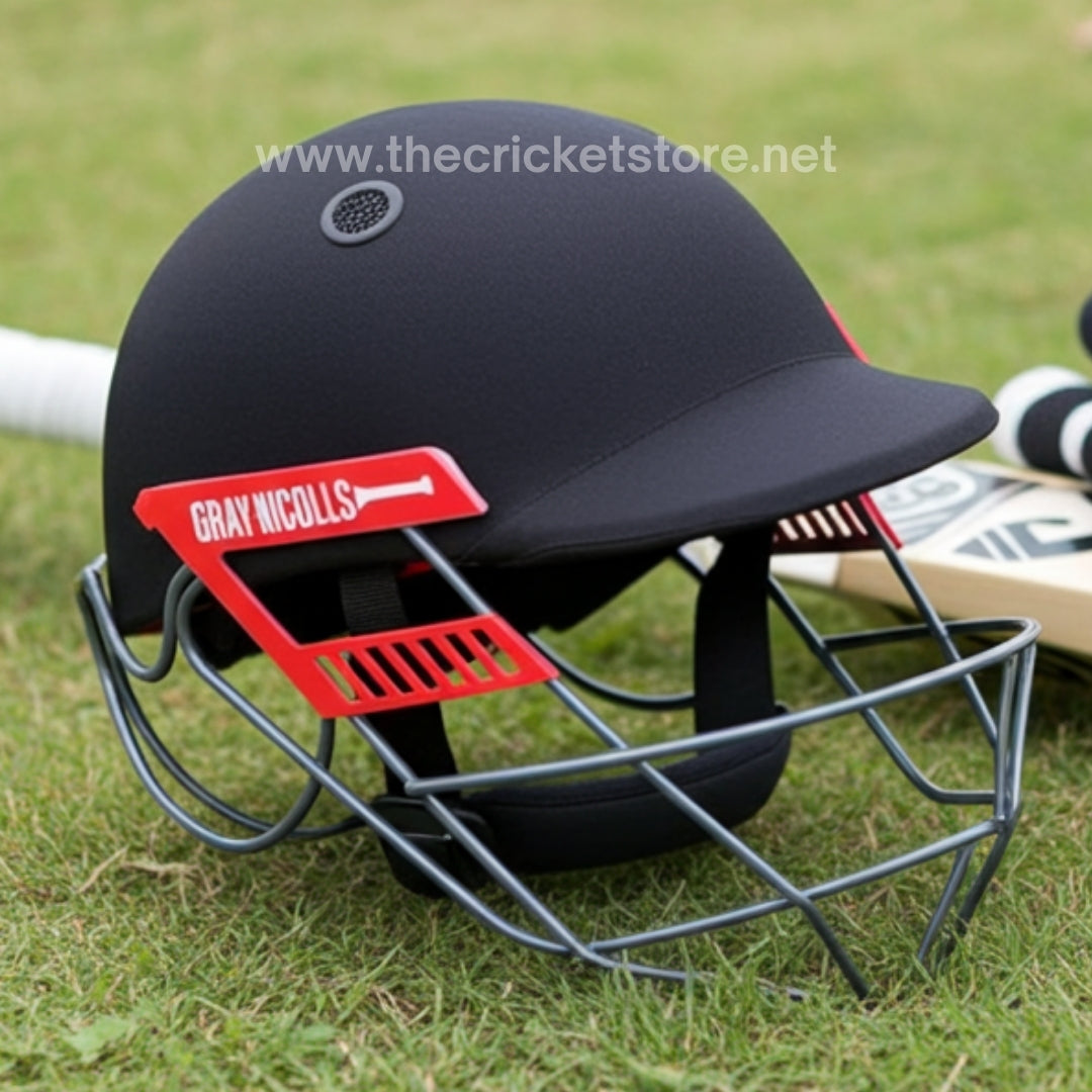 Front view of the Gray Nicolls Ultimate 360 Professional Cricket Helmet featuring the signature stainless steel grill and compact shell.